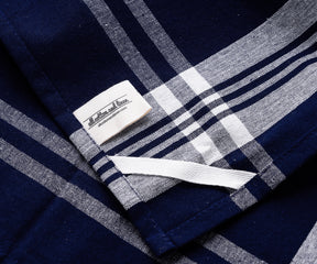 Close-up of a blue and white checked farmhouse kitchen hand towel