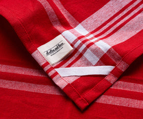 Red and white striped farmhouse kitchen towel close-up