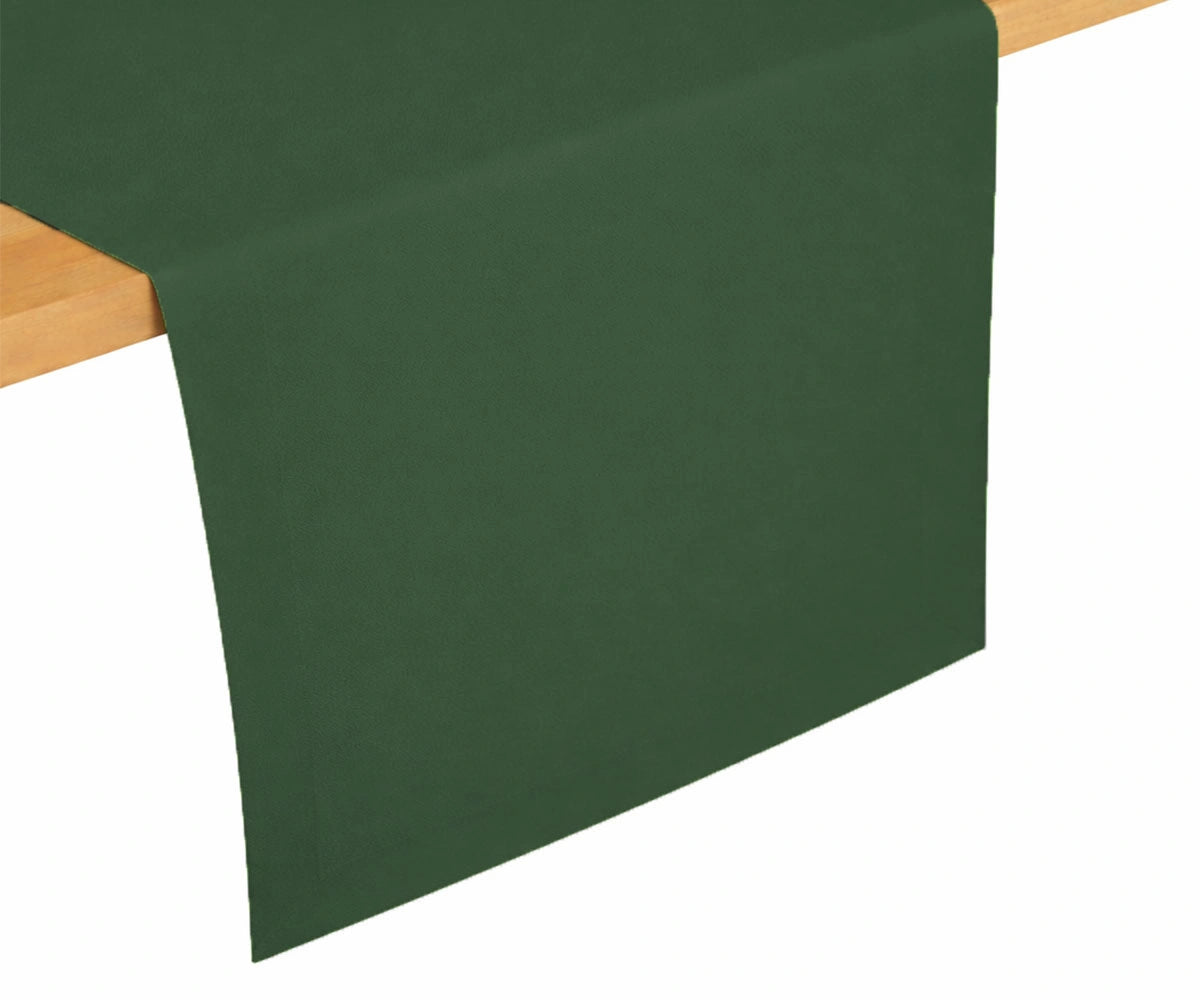 Forest green cotton table runner draped on dining table, deep natural shade for classic and festive table settings
