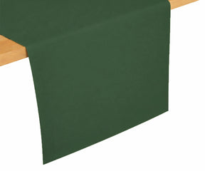 Forest green cotton table runner draped on dining table, deep natural shade for classic and festive table settings