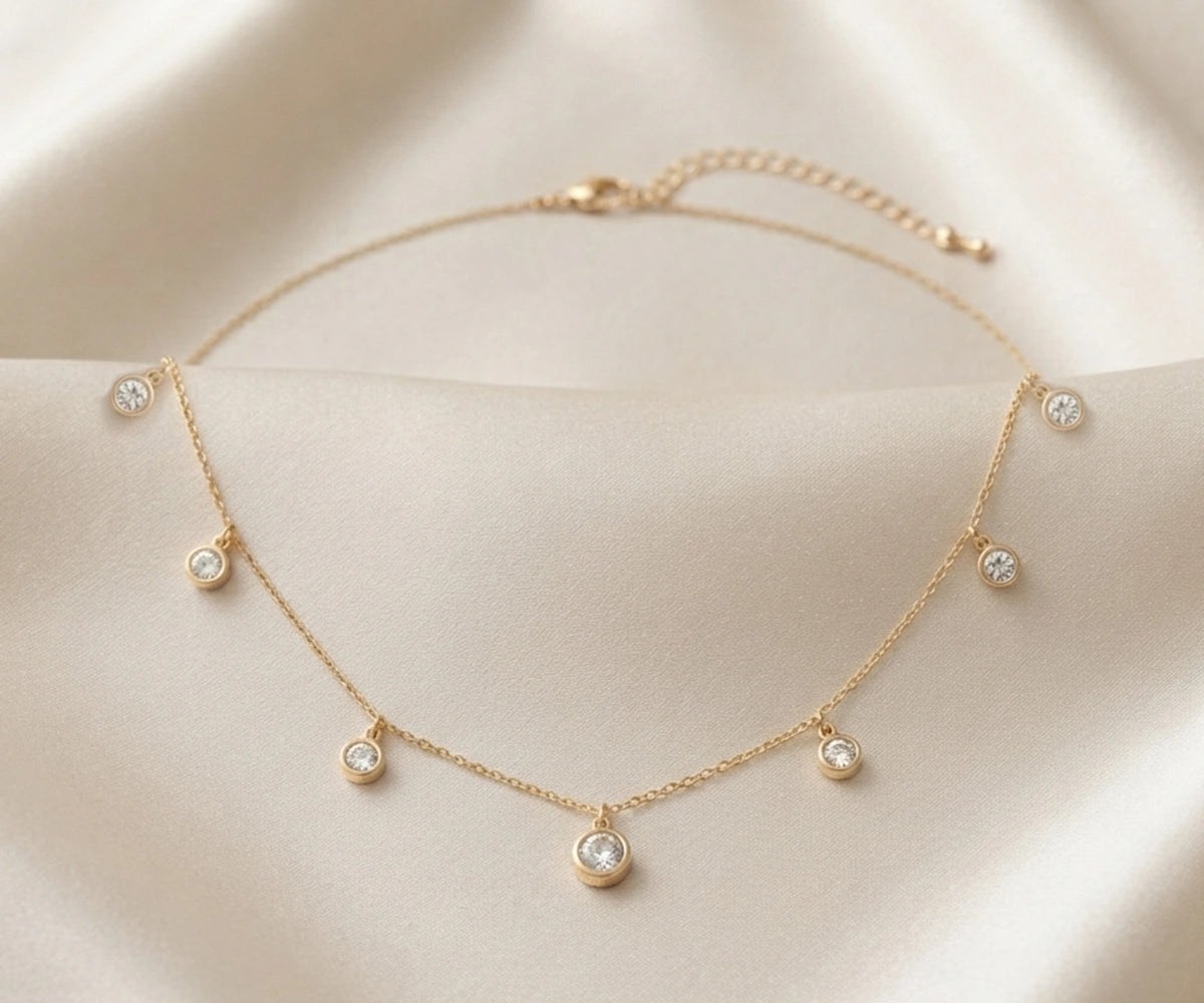 18K gold plated cubic zirconia necklace with spaced round stones
Elegant station necklace for special occasions and gifting