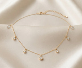 18K gold plated cubic zirconia necklace with spaced round stones
Elegant station necklace for special occasions and gifting