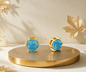 blue topaz birthstone earrings for December birthdays with cool blue elegance and premium shine