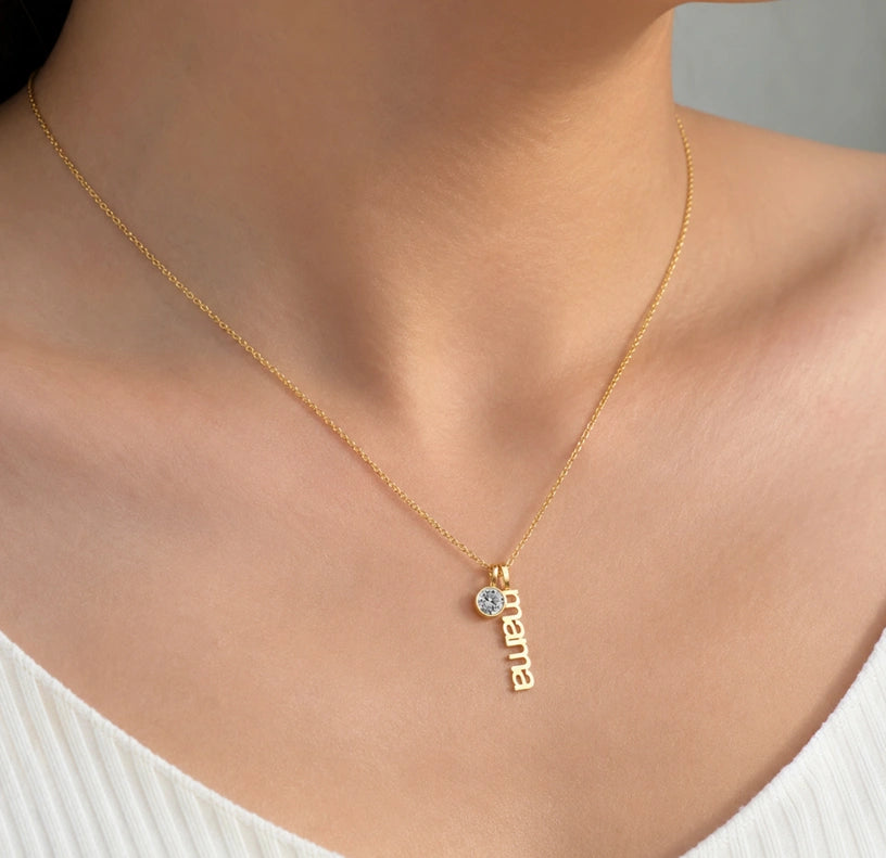 Mama necklace with April diamond birthstone featuring a timeless personalized gold pendant style.
Luxury-inspired birthstone necklace gift for mothers, wives, and new moms.