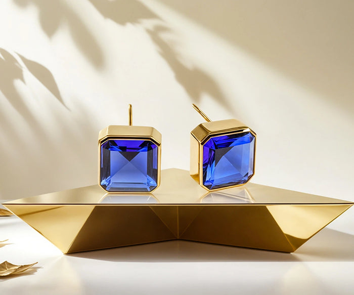Elegant gold plated sapphire stud earrings with blue Asscher-cut stone, lightweight gemstone jewelry for everyday wear and special occasions.