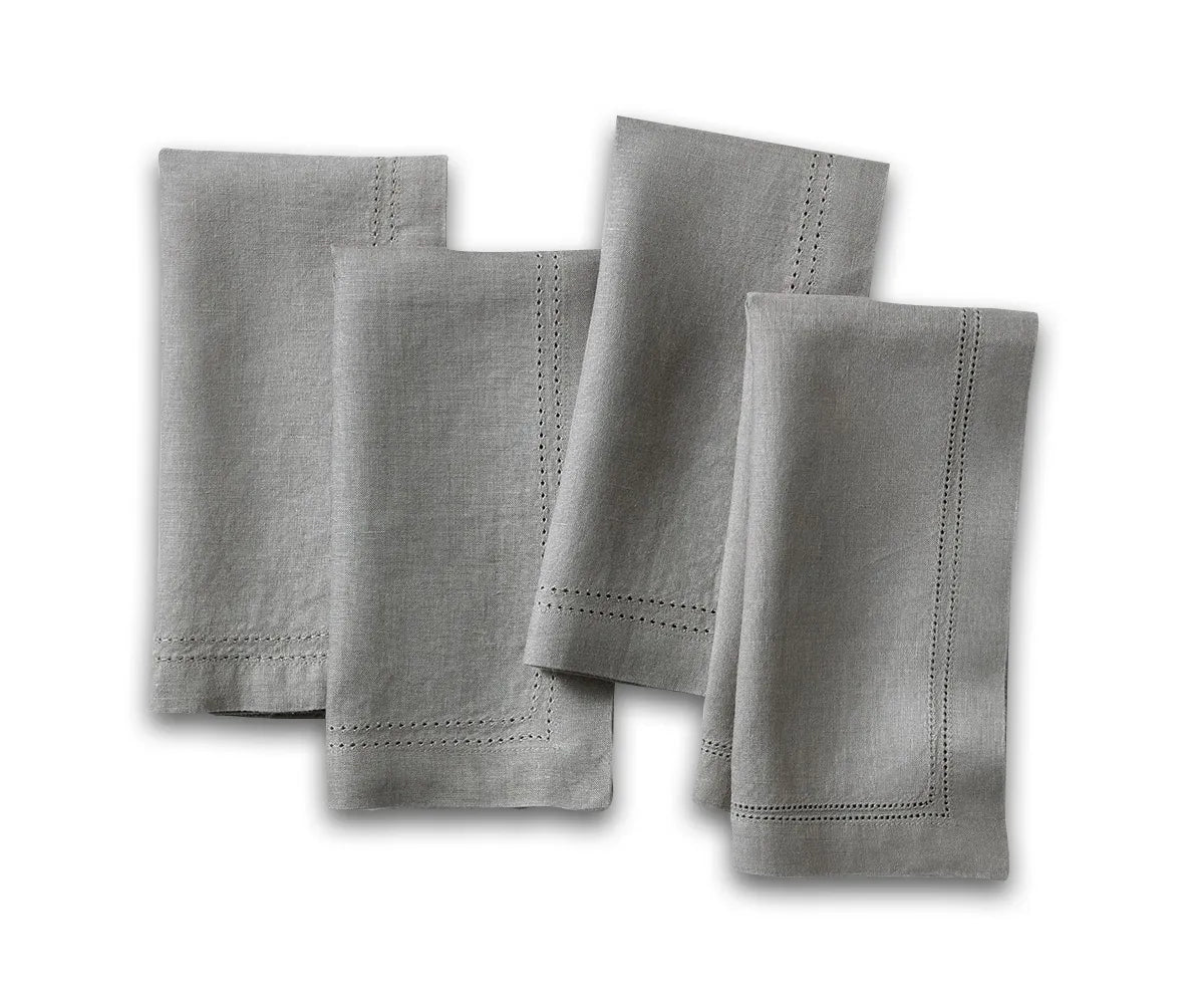 Elegant charcoal grey linen napkins with double hemstitch border – folded set on dining table