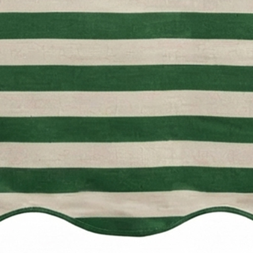 Green and white cabana striped table runner with a scalloped edge detail.