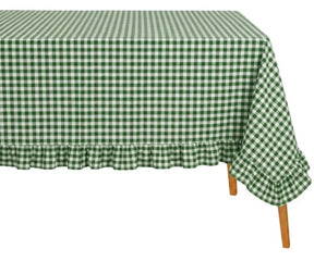 Farmhouse style gingham tablecloth with soft texture and ruffled border enhancing dining room aesthetics