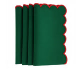 Classic scalloped dining napkins featuring red trim accents