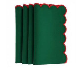 Classic scalloped dining napkins featuring red trim accents