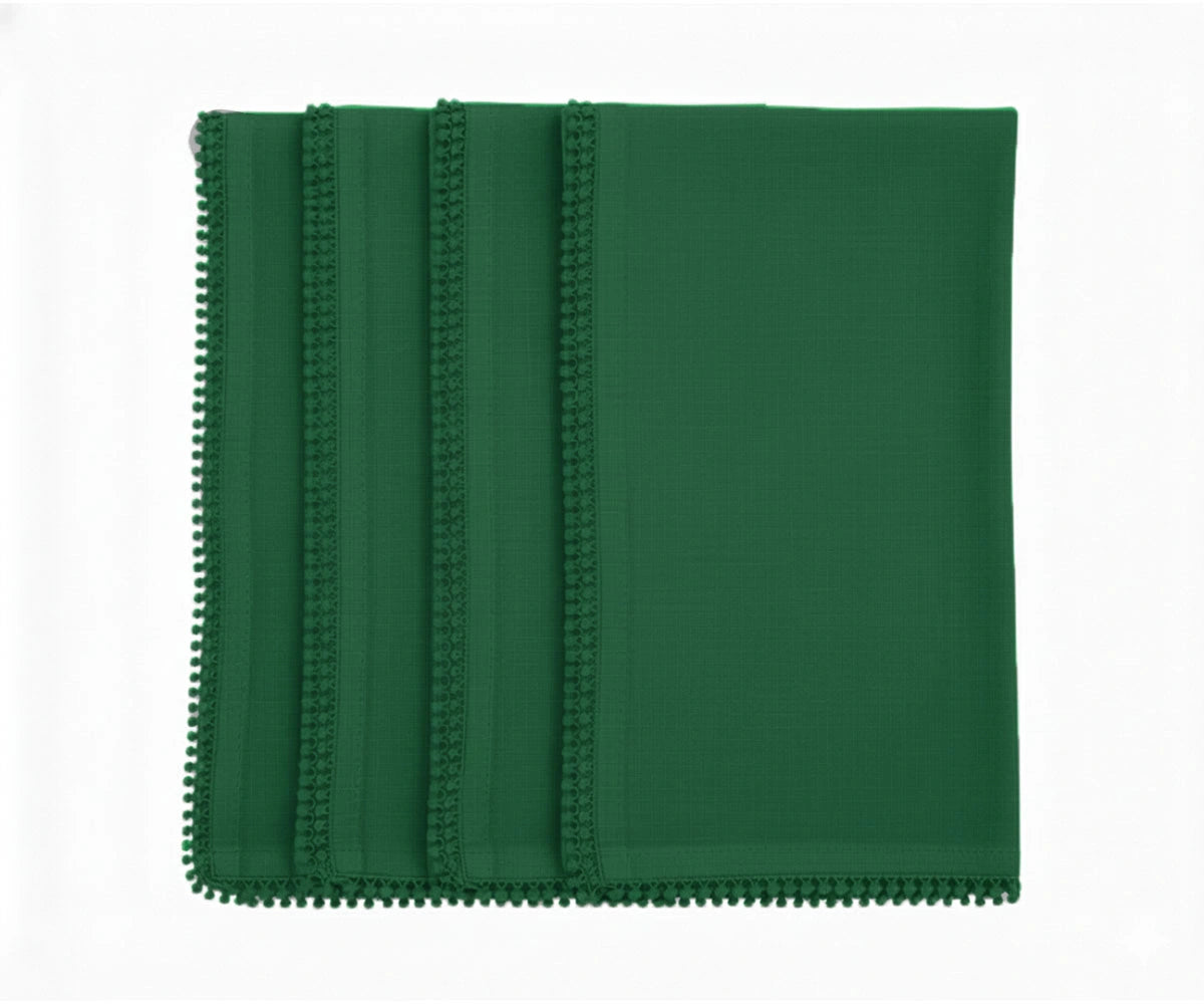 Green cotton pom pom napkins with knotted edge for fresh and vibrant table décor