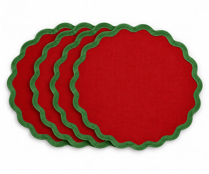red cotton placemat with contrasting green scalloped edge trim, festive fabric table mat for Christmas dining tables, holiday dinners, family gatherings, and seasonal table decor