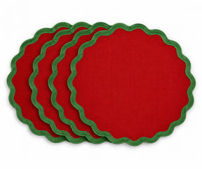 red cotton placemat with contrasting green scalloped edge trim, festive fabric table mat for Christmas dining tables, holiday dinners, family gatherings, and seasonal table decor