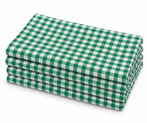 Stack of four neatly folded 100% cotton cloth dinner napkins in a green and white gingham check pattern, displayed on a plain white background.