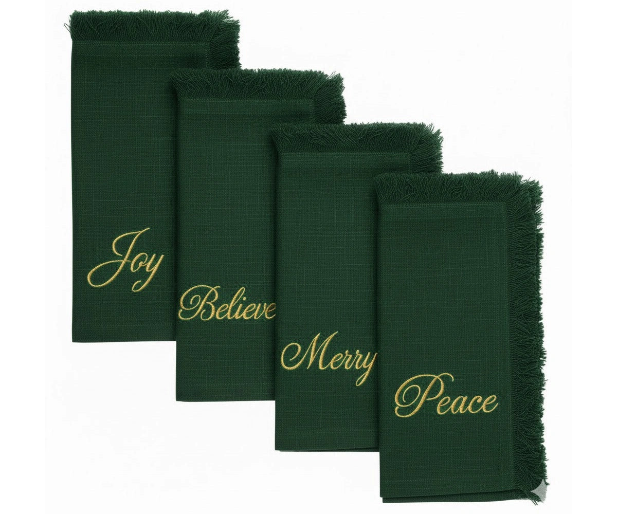 Green fringe edge cotton napkins with gold embroidered Joy, Believe, Merry & Peace – perfect for holiday table décor