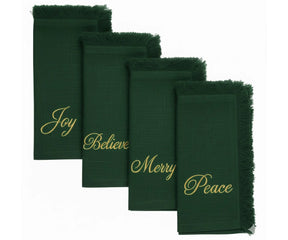 Green fringe edge cotton napkins with gold embroidered Joy, Believe, Merry & Peace – perfect for holiday table décor