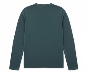 Model wearing vibrant green long sleeve t-shirt, relaxed look

