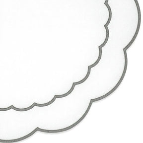 Round grey cotton placemat featuring scalloped edging and subtle peony embroidery for refined décor