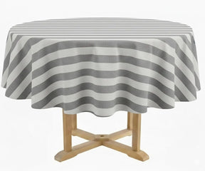 Gray and white striped round tablecloth in 60 inch size crafted from 100% cotton, styled on a round dining table with coordinating dinner napkins and neutral place settings. This cabana stripe round tablecloth suits farmhouse, coastal, and modern décor, ideal for indoor dining, patio entertaining, outdoor gatherings, weddings, and seasonal table styling.