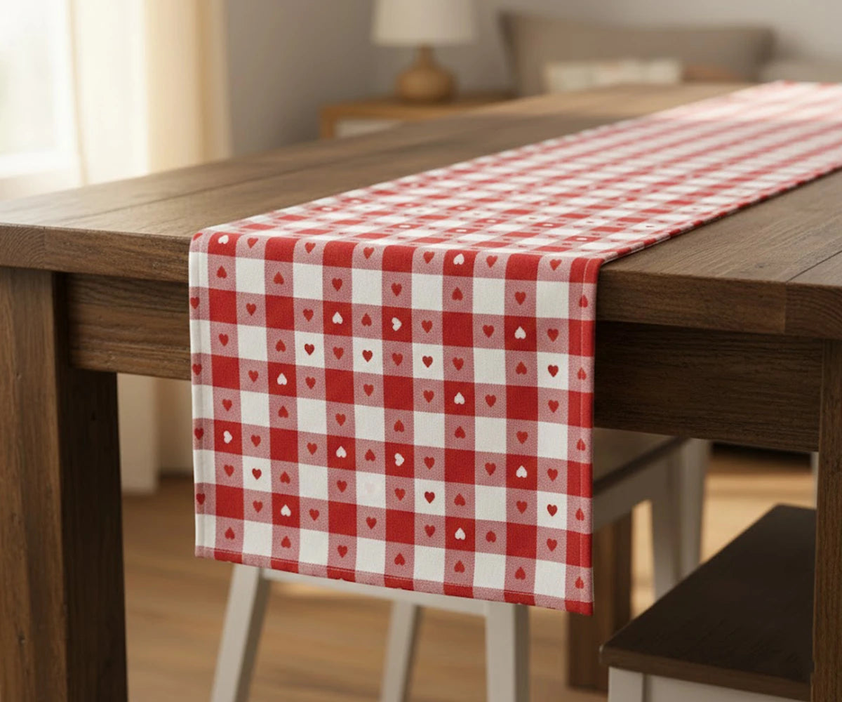 Red heart printed cotton table runner on wooden dining table