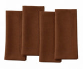 Set of four coffee brown hemstitch dinner napkins neatly folded side by side on a white background