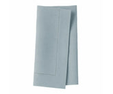 Delicate single hemstitched tourmaline napkins adding refined detail to meals.
