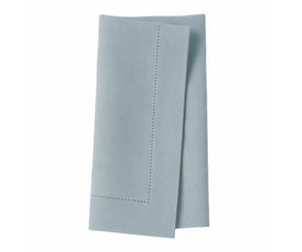 Delicate single hemstitched tourmaline napkins adding refined detail to meals.
