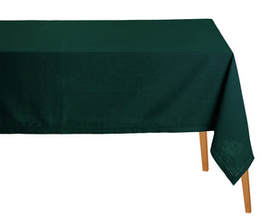 Green tablecloth on a wooden table with a white background