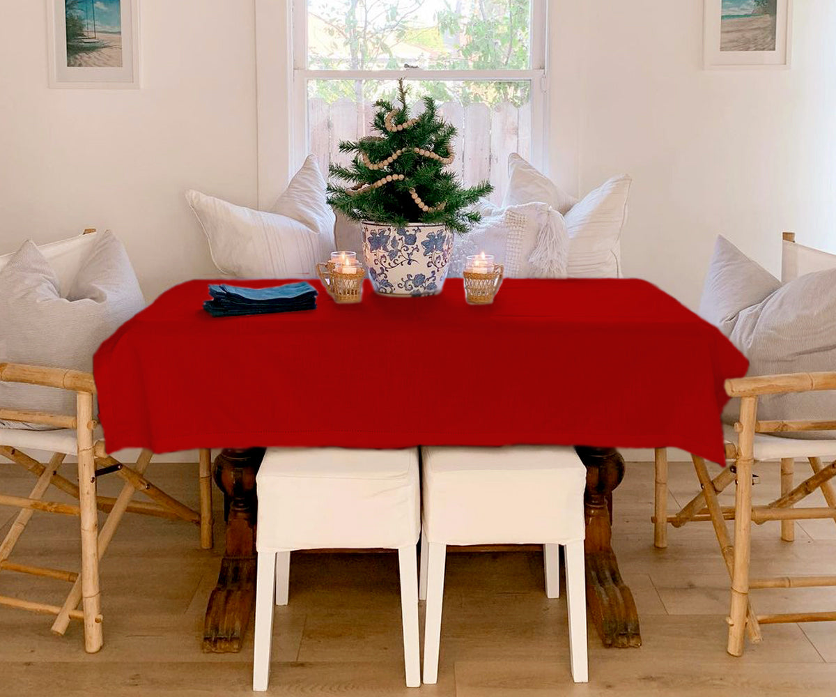 "Infuse warmth with red, elevate with fabric textures, and celebrate Christmas joy with our varied tablecloth selection."