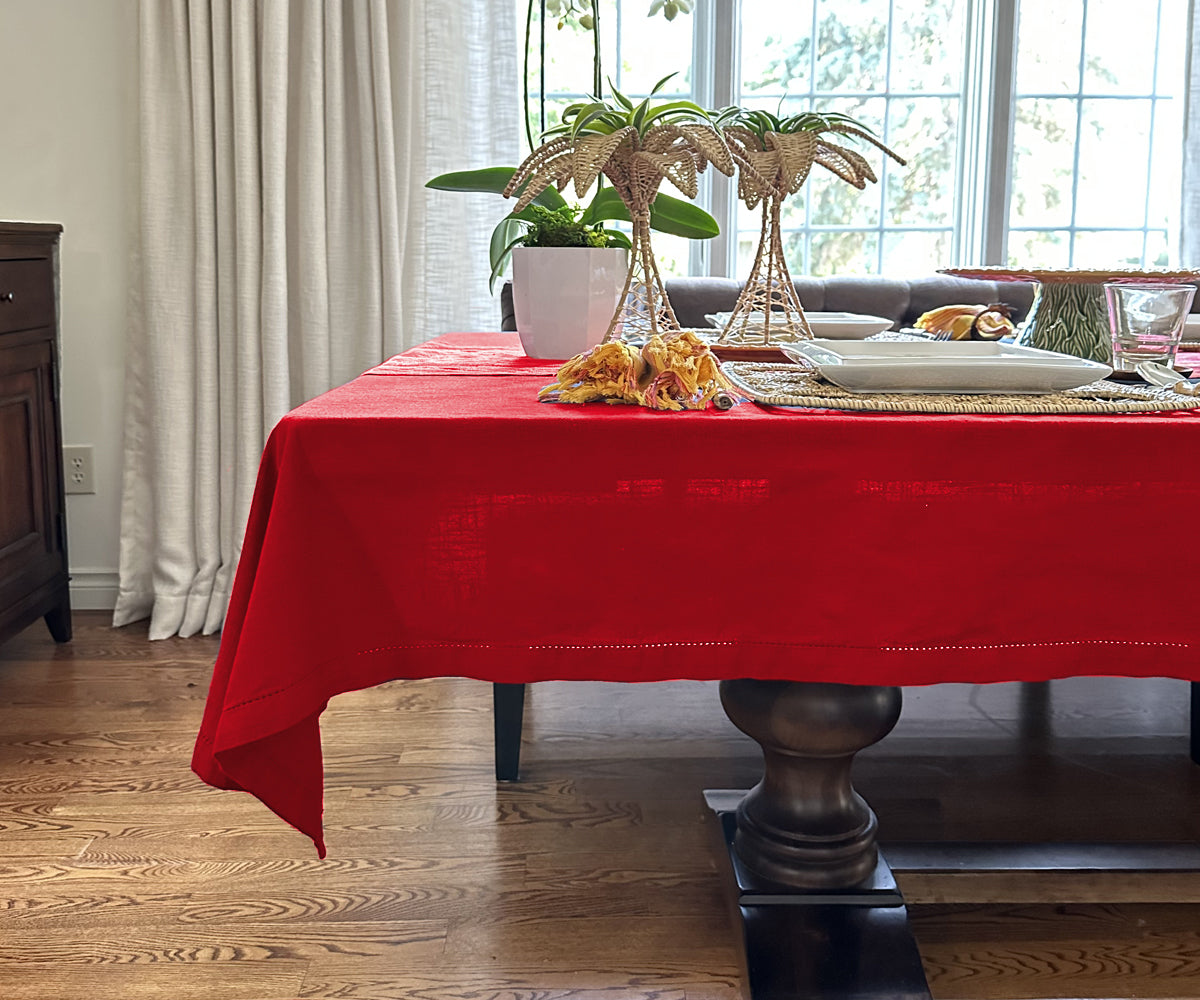 "Embrace warmth with red, elevate with fabric textures, and celebrate Christmas with our versatile tablecloth assortment."
