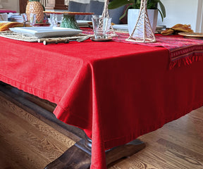 "Embrace warmth with red, elevate with fabric textures, and celebrate Christmas with our versatile tablecloth selection."