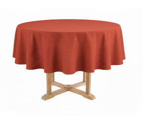 Round table with a red tablecloth on a white background