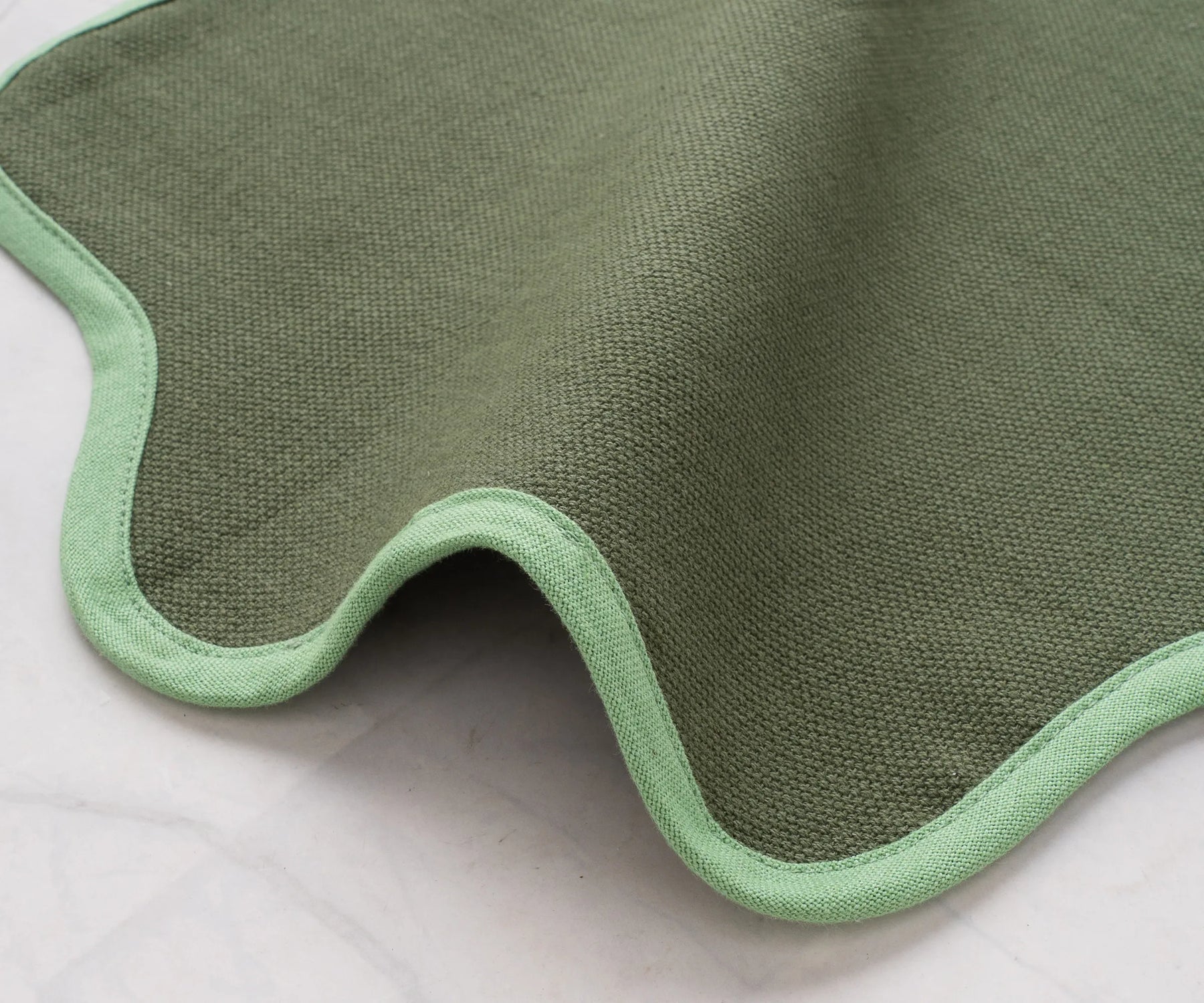 Green decorative scalloped edge placemat for holiday and everyday use