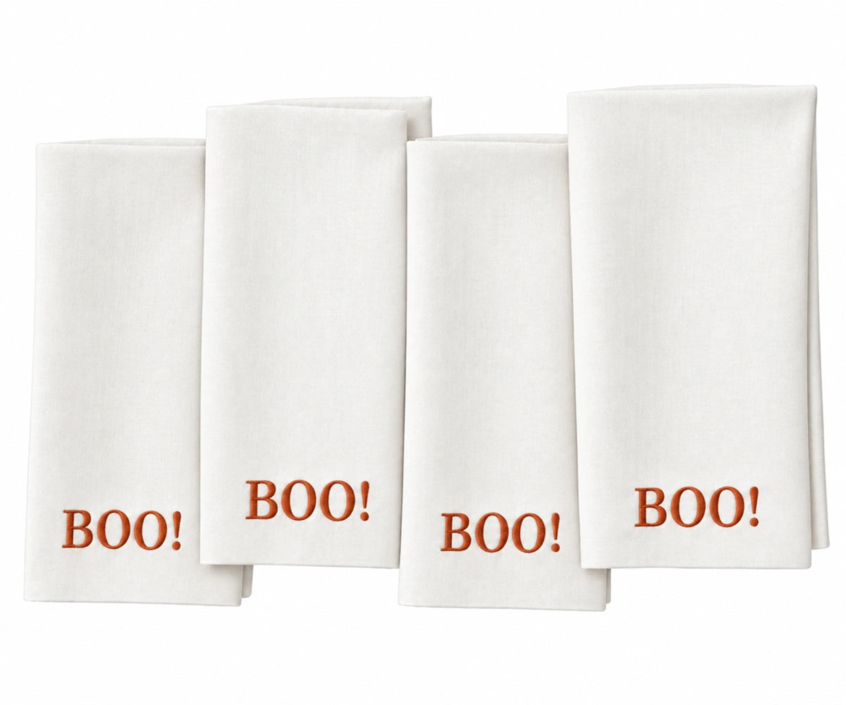 White and rust BOO Halloween cloth napkin for fall table decor and Halloween parties Reusable dinner napkin for seasonal entertaining, Halloween gatherings, autumn dining, and festive table settings.