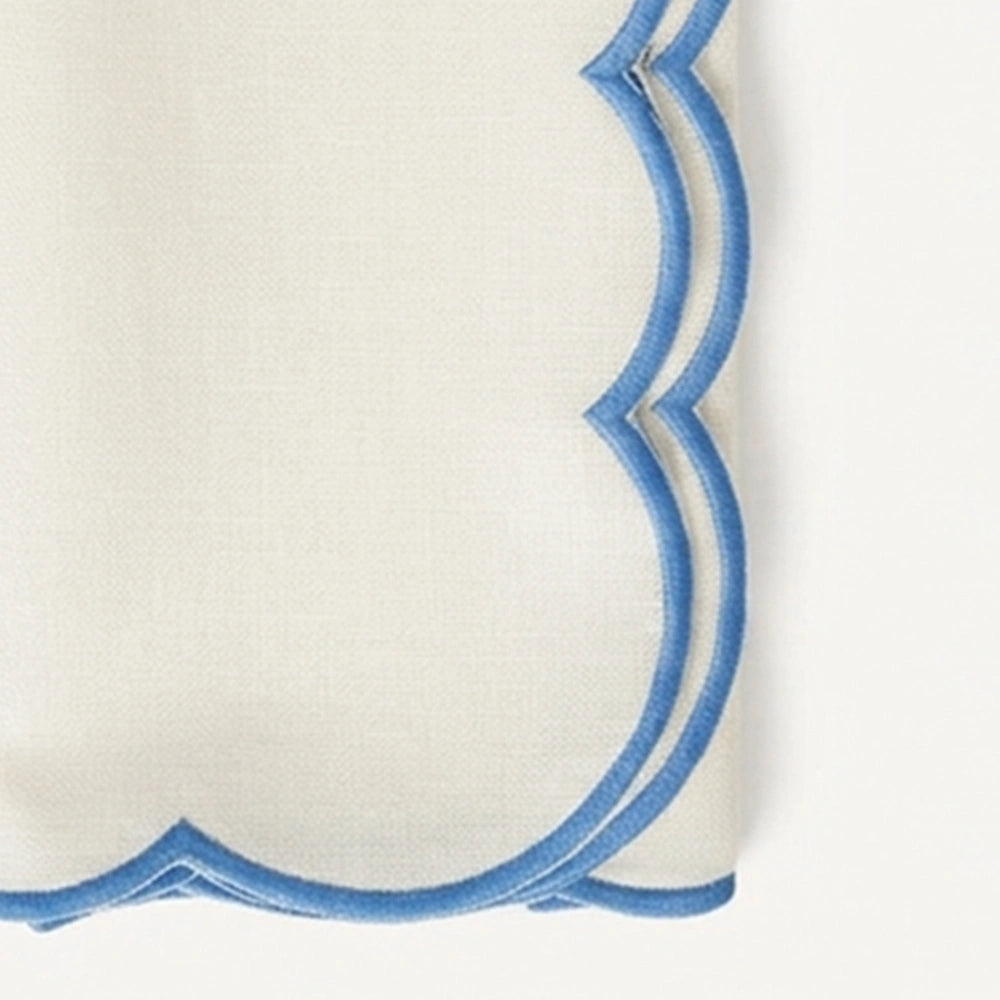 Ivory scalloped edge cloth napkins with blue trim for coastal table décor, reusable cotton dinner napkins for weddings and summer brunch tables