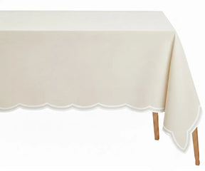 Ivory rectangle tablecloth with white scalloped edge made from 100 percent cotton on dining table