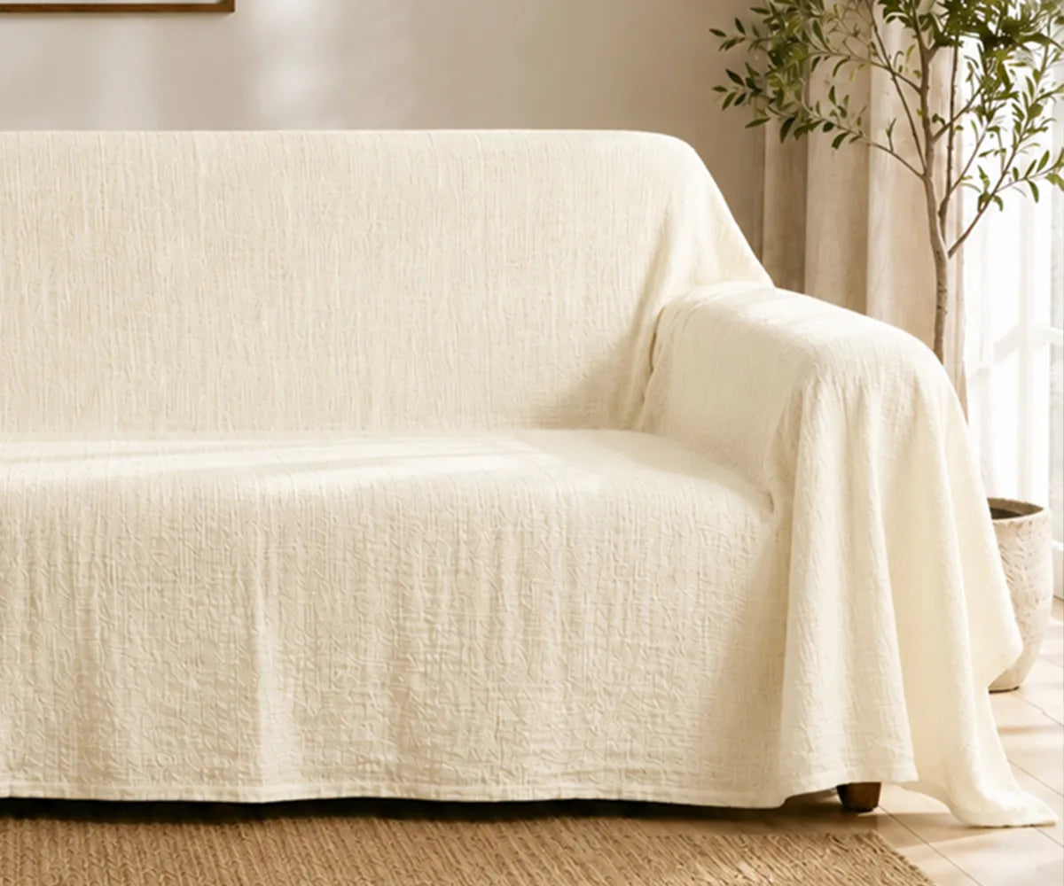 Modern linen couch throw cover that provides stylish protection for living room furniture.