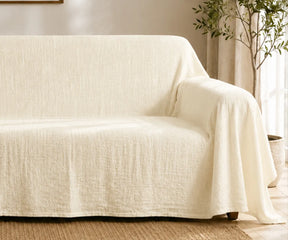 Modern linen couch throw cover that provides stylish protection for living room furniture.