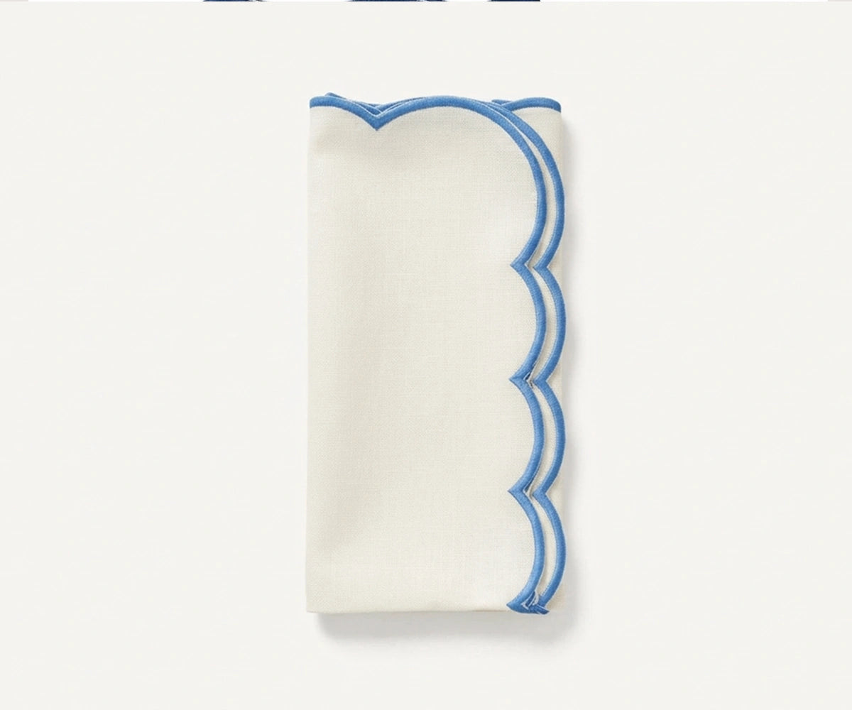Soft ivory cotton napkins with blue scalloped border, elegant reusable table linens for farmhouse dining rooms and festive celebrations