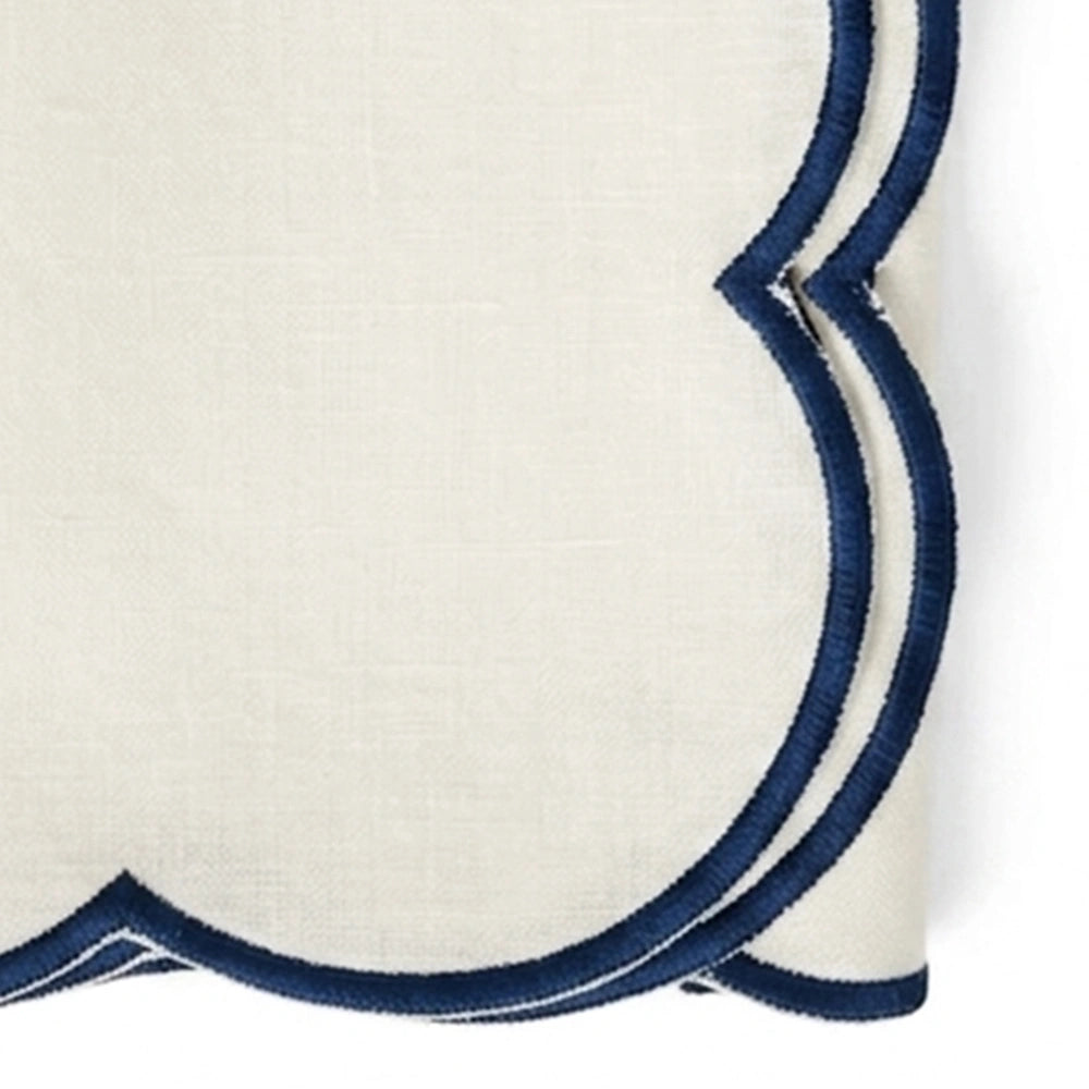 Soft ivory reusable napkins with navy blue trim, scalloped edge cotton table linens for upscale brunches, receptions, and family dining