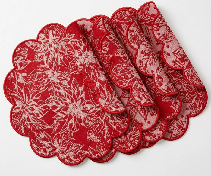 Round white cotton placemat featuring an elegant floral pattern and scalloped edge