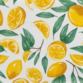 A set of folded fabric pieces featuring a bright lemon.