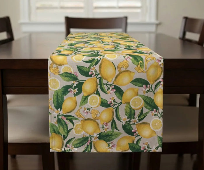 Cotton table runner with vibrant yellow lemon print on a light background, featuring a fresh citrus pattern ideal for kitchen or dining table decor, perfect for summer and farmhouse-style settings.Select 69 more words to run Humanizer.