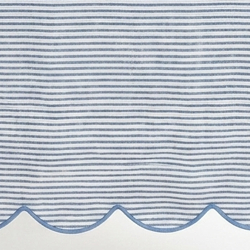 Blue striped linen tablecloth material featuring a detailed scallop hem design for modern kitchen and dining decor.