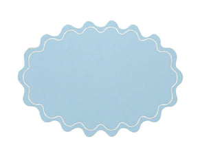 Reusable oval cotton placemat with graceful wavy edges, perfect for elevated table styling and gatherings