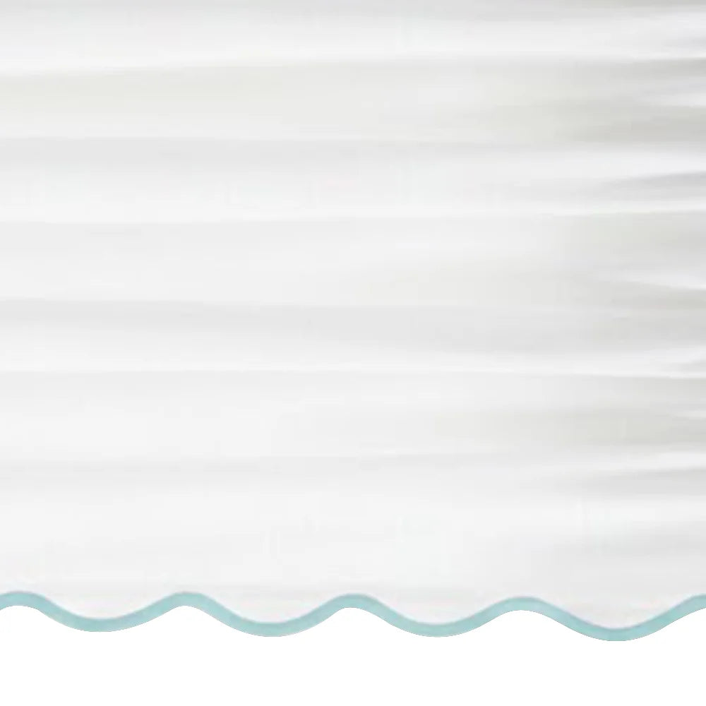 White scalloped curtain panel with light blue trim - Close up