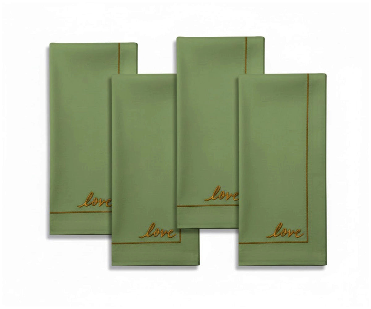 Sage green cotton cloth napkins with delicate embroidered detail, soft earthy tone for farmhouse and modern dining tables