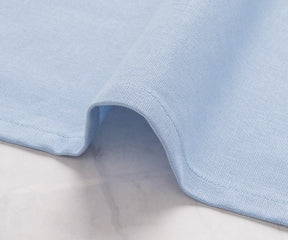 Elegant plain light blue napkins styled for a wedding reception table