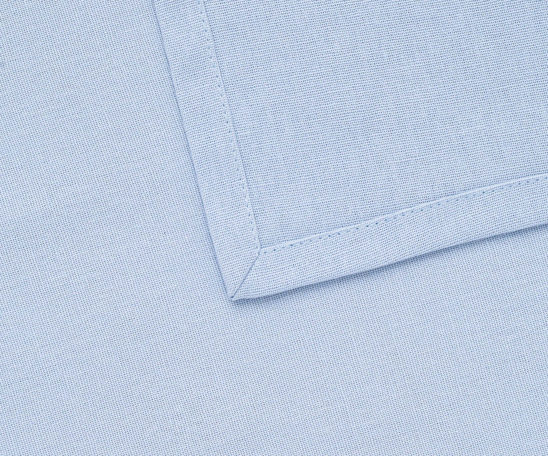 Durable 100% cotton light blue napkins stacked in bulk for events