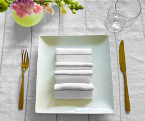 Discover the art of folding dinner napkins, explore various sizes including linen options, perfect for weddings, and learn how to creatively fold napkins for a stylish dinner presentation.